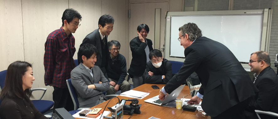 Employees working together smiling